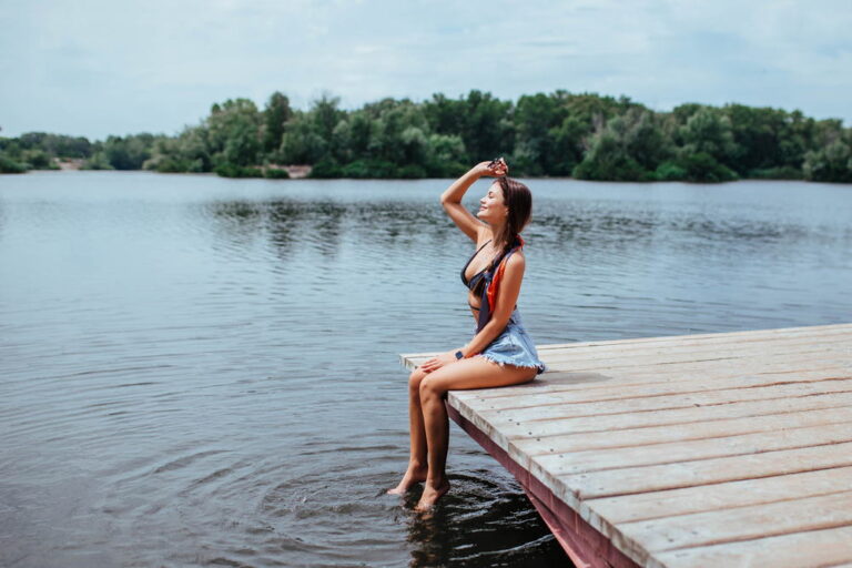 Girl sitting near a lake in switzerland