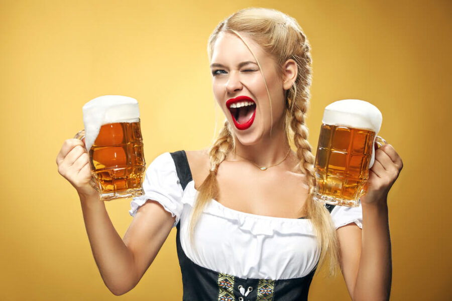 Blonde model holding two beer steins